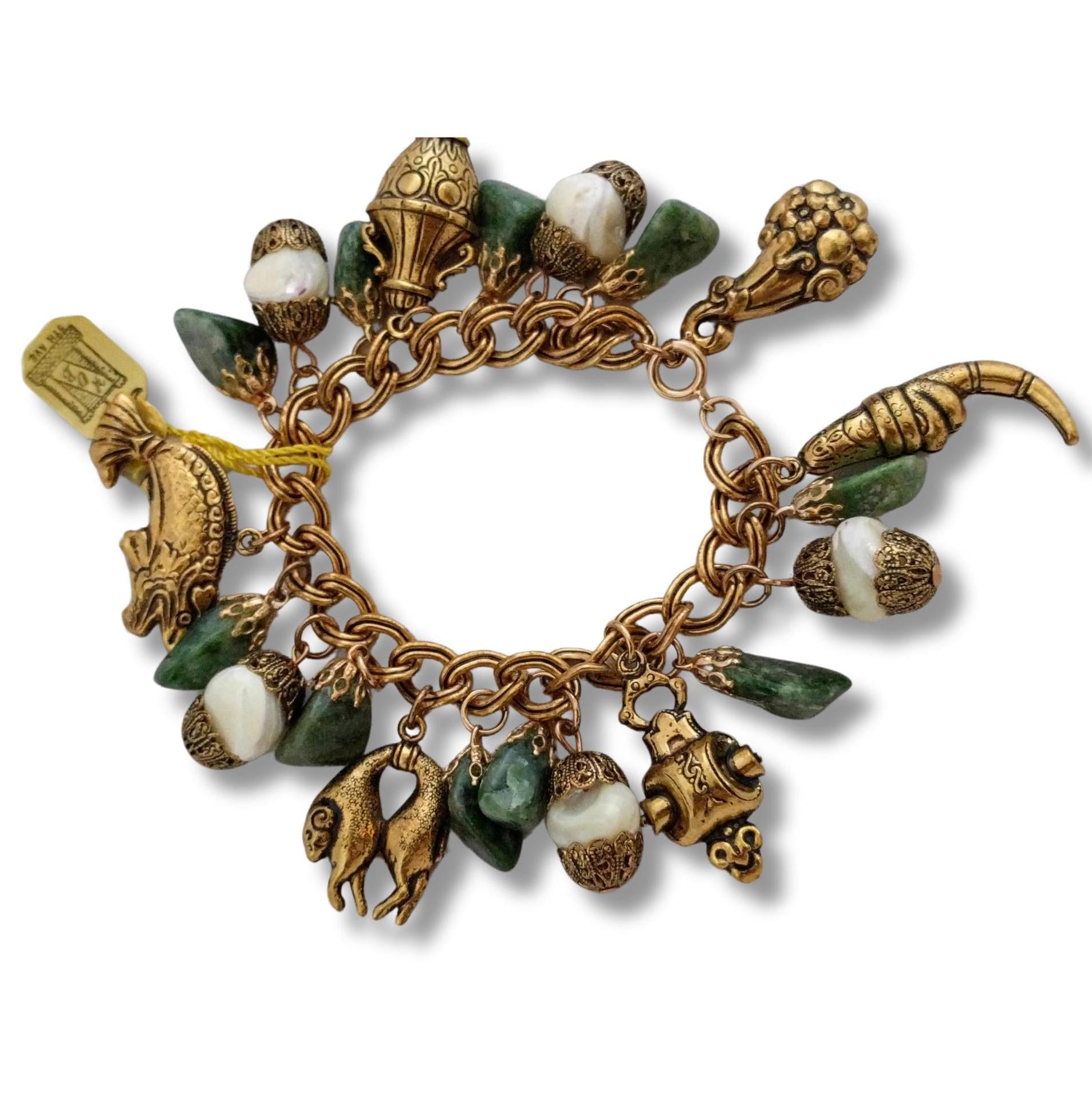 Gold-tone charm bracelet with genuine jade and mother of pearl charms - HOB 5th Ave jade bracelet