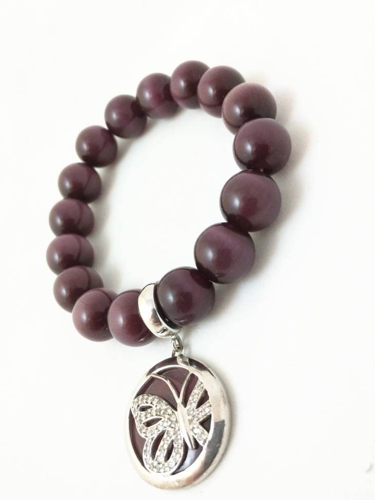 Elegant gemstone bracelet with silver charm, medium elastic, purple tiger eye beads