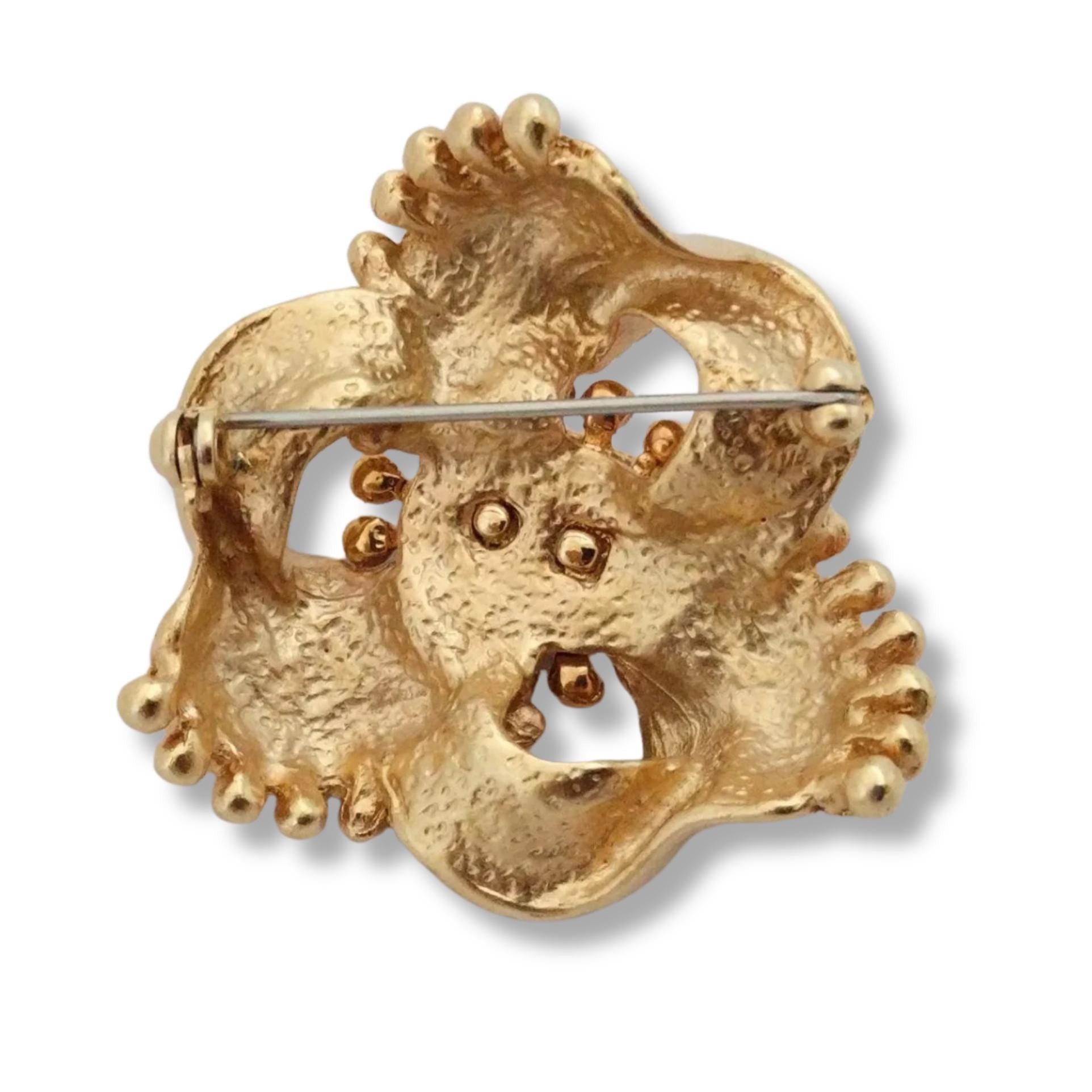 Elegant brushed gold-plated DKNY brooch, sculpted floral motif, pre-loved luxury