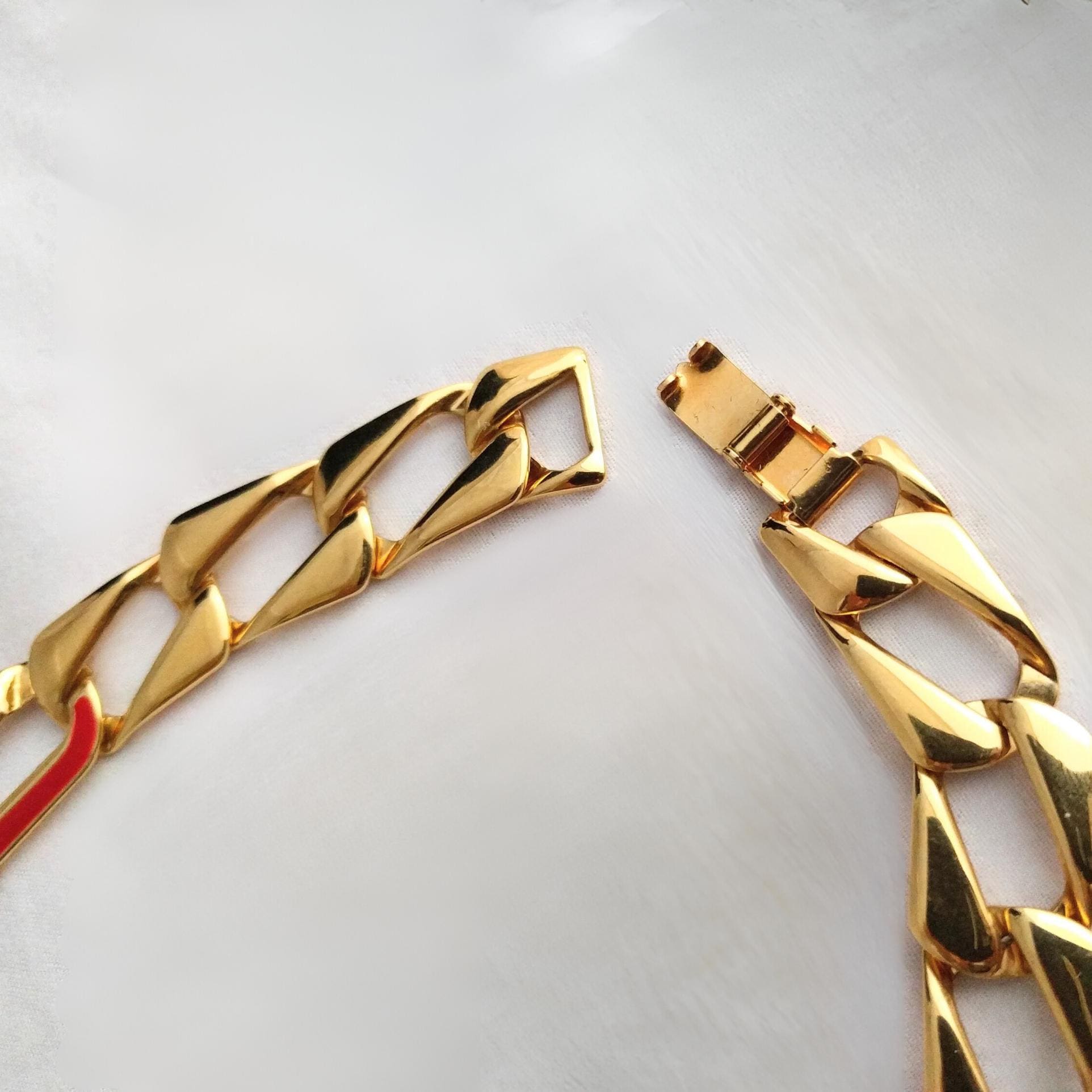 Vintage MONET necklace, 21-inch gold chain link with red enamel, signed MONET