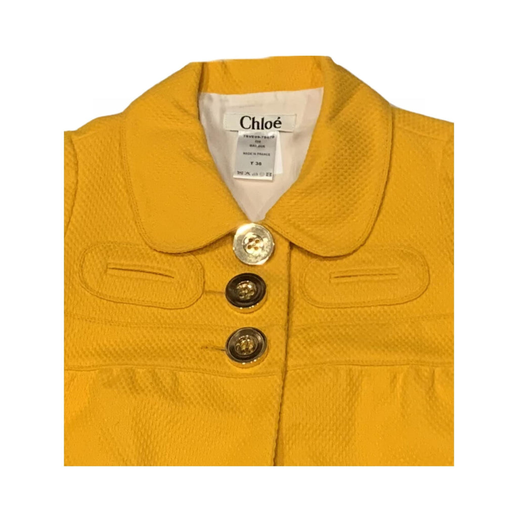 Elegant Chloé structured silk jacket, vibrant mango hue, Parisian chic style