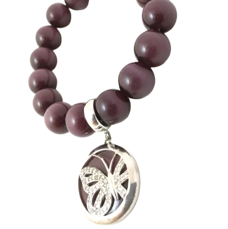 Elegant gemstone bracelet with silver charm, medium elastic, purple tiger eye beads