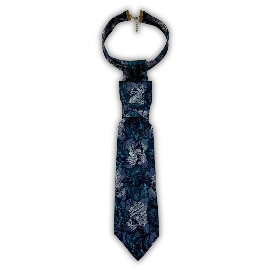 A repurposed teal and charcoal abstract Lanvin silk tie reworked into a women's continental crossover tie.
