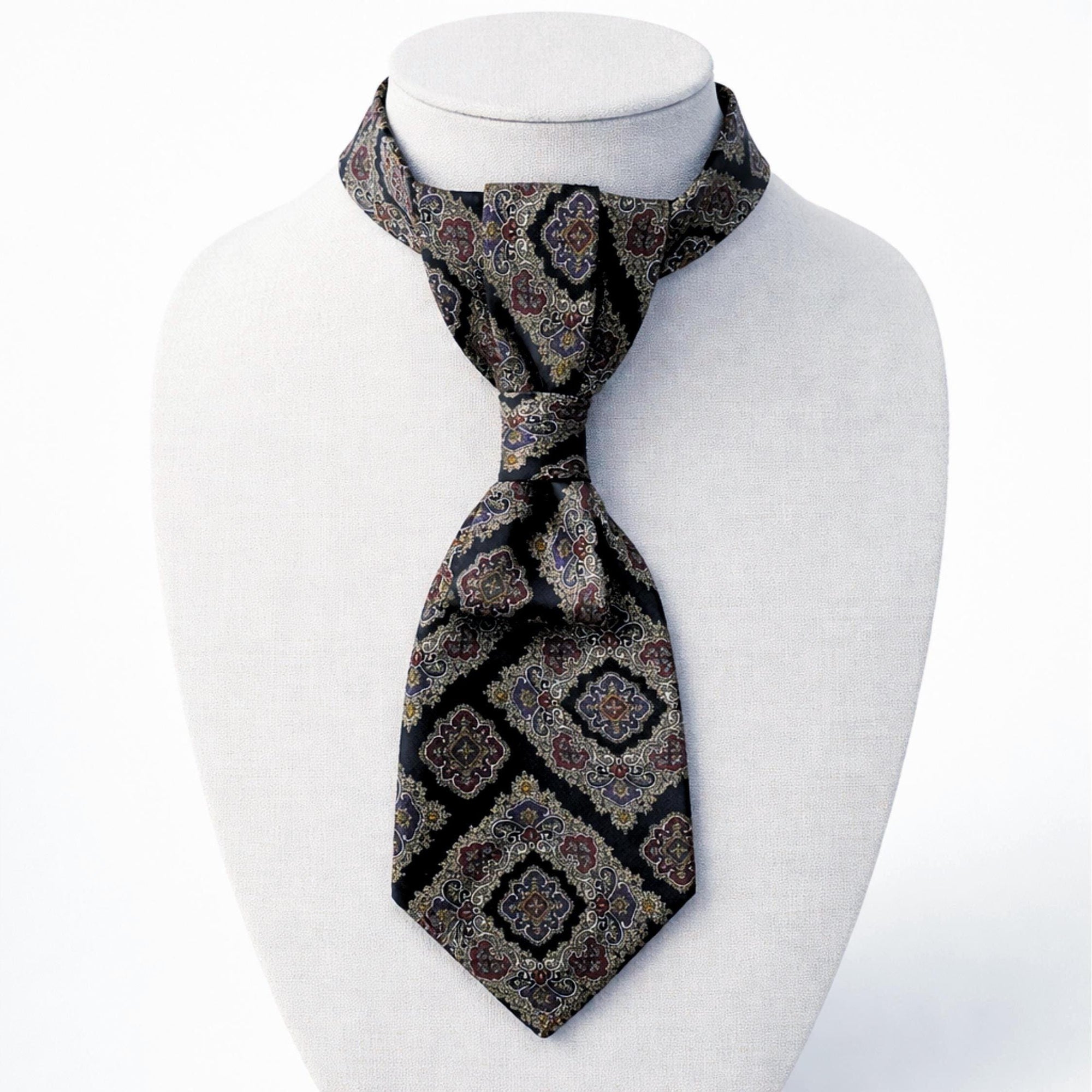 Flat lay of a handmade women’s butterfly-style necktie made from a vintage Dior designer tie featuring an ornate medallion pattern.