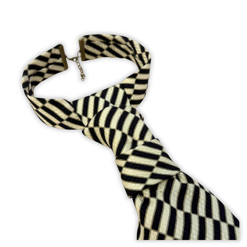 Sustainable luxury accessory: A handmade women’s butterfly-style necktie made from a vintage Stefano Ricci designer tie in a bold checkerboard print.