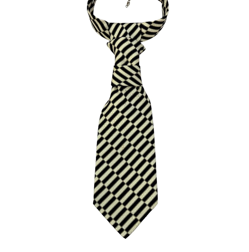 A repurposed gold and black geometric Stefano Ricci silk tie reworked into a women's continental crossover tie with an adjustable gold chain.