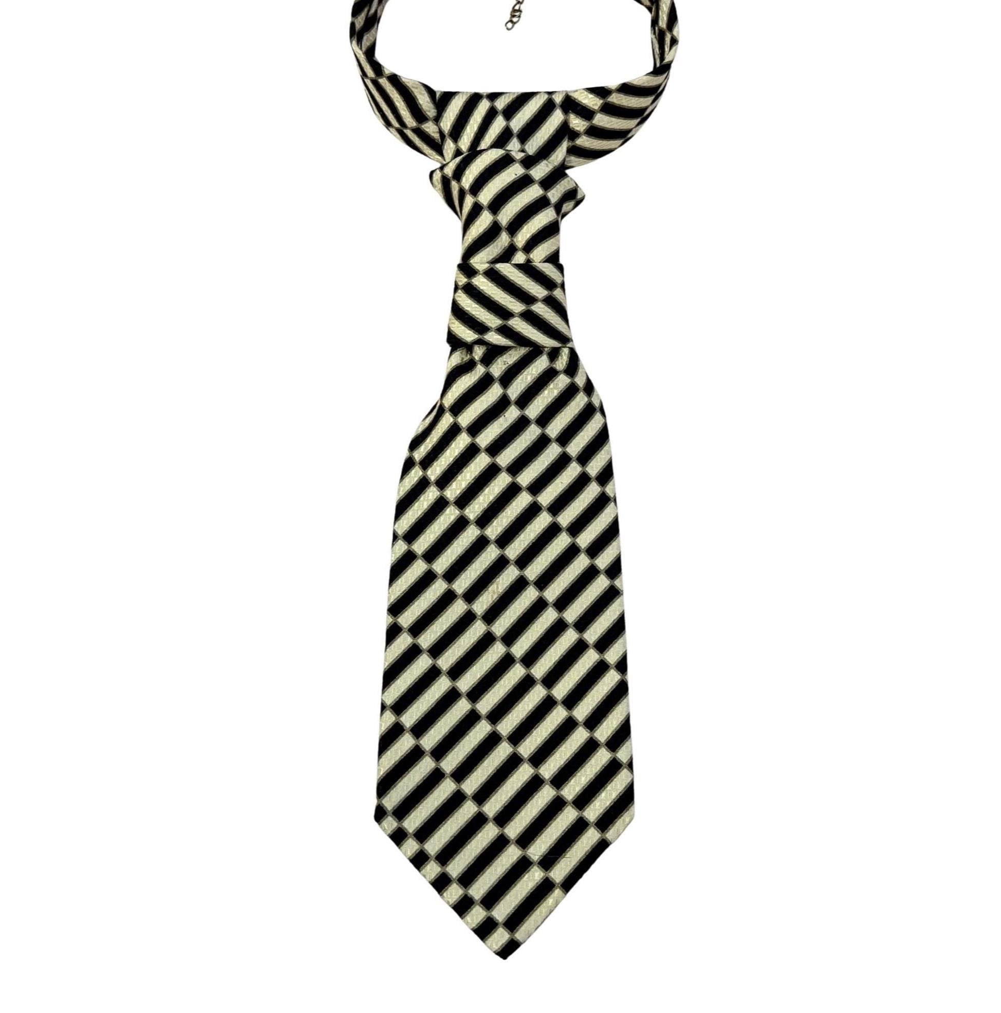 A repurposed gold and black geometric Stefano Ricci silk tie reworked into a women's continental crossover tie with an adjustable gold chain.