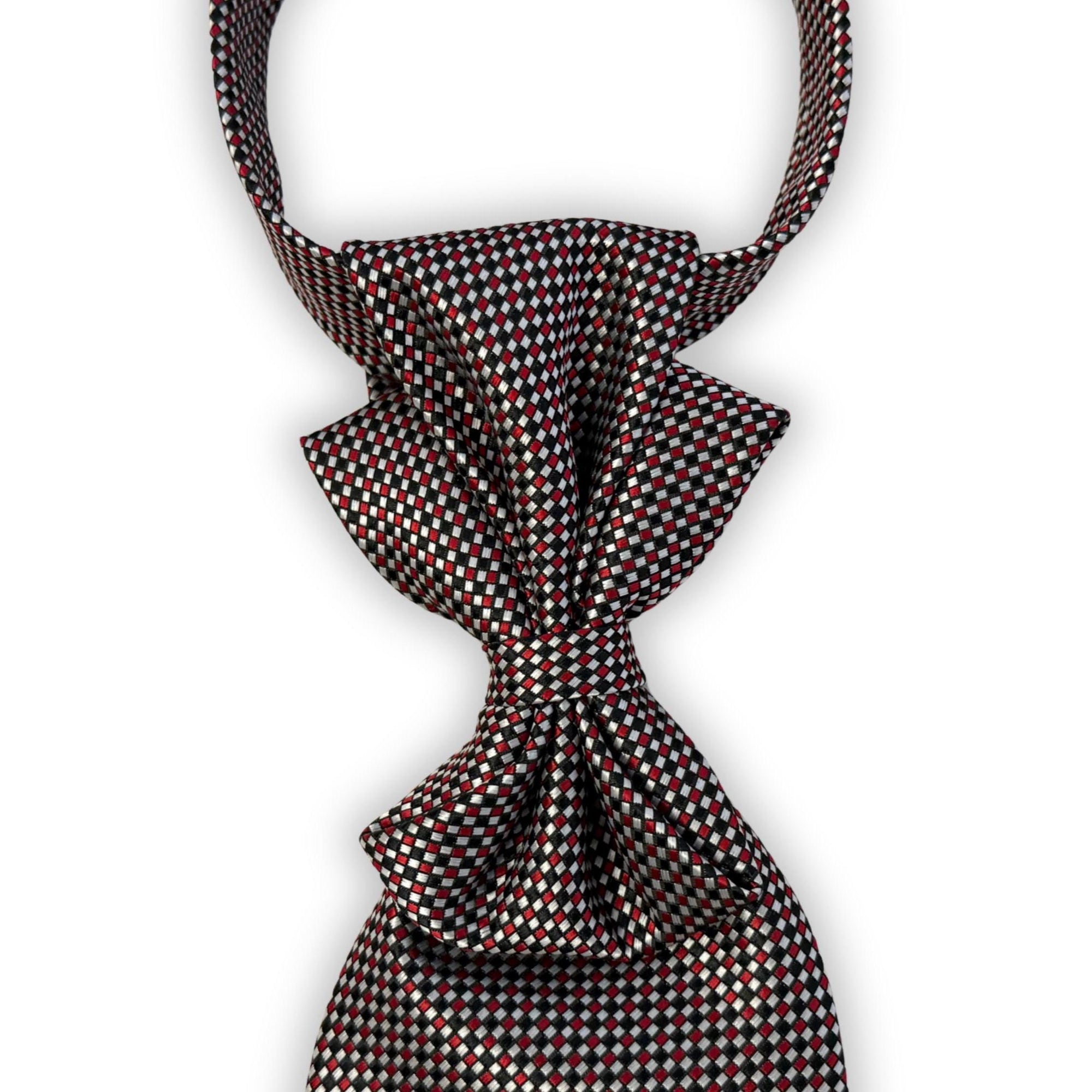 Flat lay of a handmade women’s butterfly-style necktie made from a vintage Italian Hugo Boss designer tie featuring a textured silver weave.
