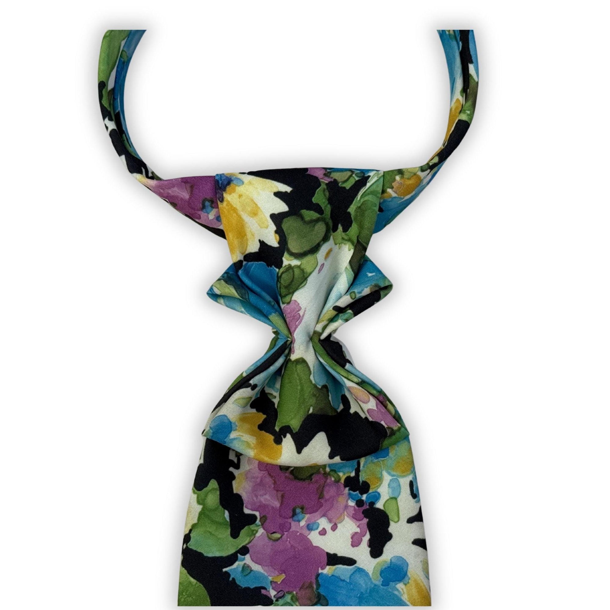 Flat lay of a handmade women’s butterfly-style necktie featuring a vibrant blue and purple painterly botanical pattern.