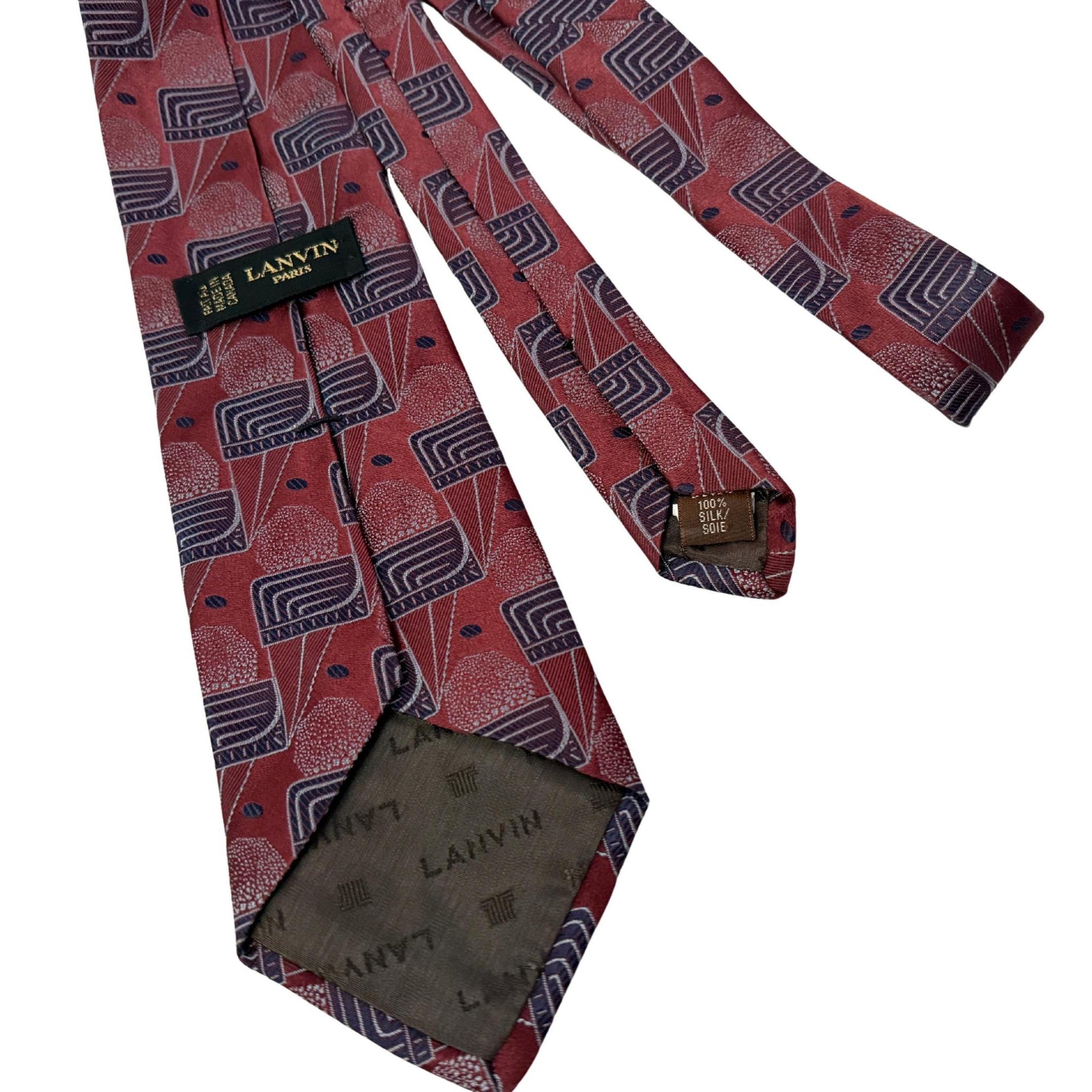 Authentic archival Lanvin Paris silk tie. Features a 9cm blade and an intricate deep burgundy and slate Deco-geometric print. A design-forward choice for the self-made professional.