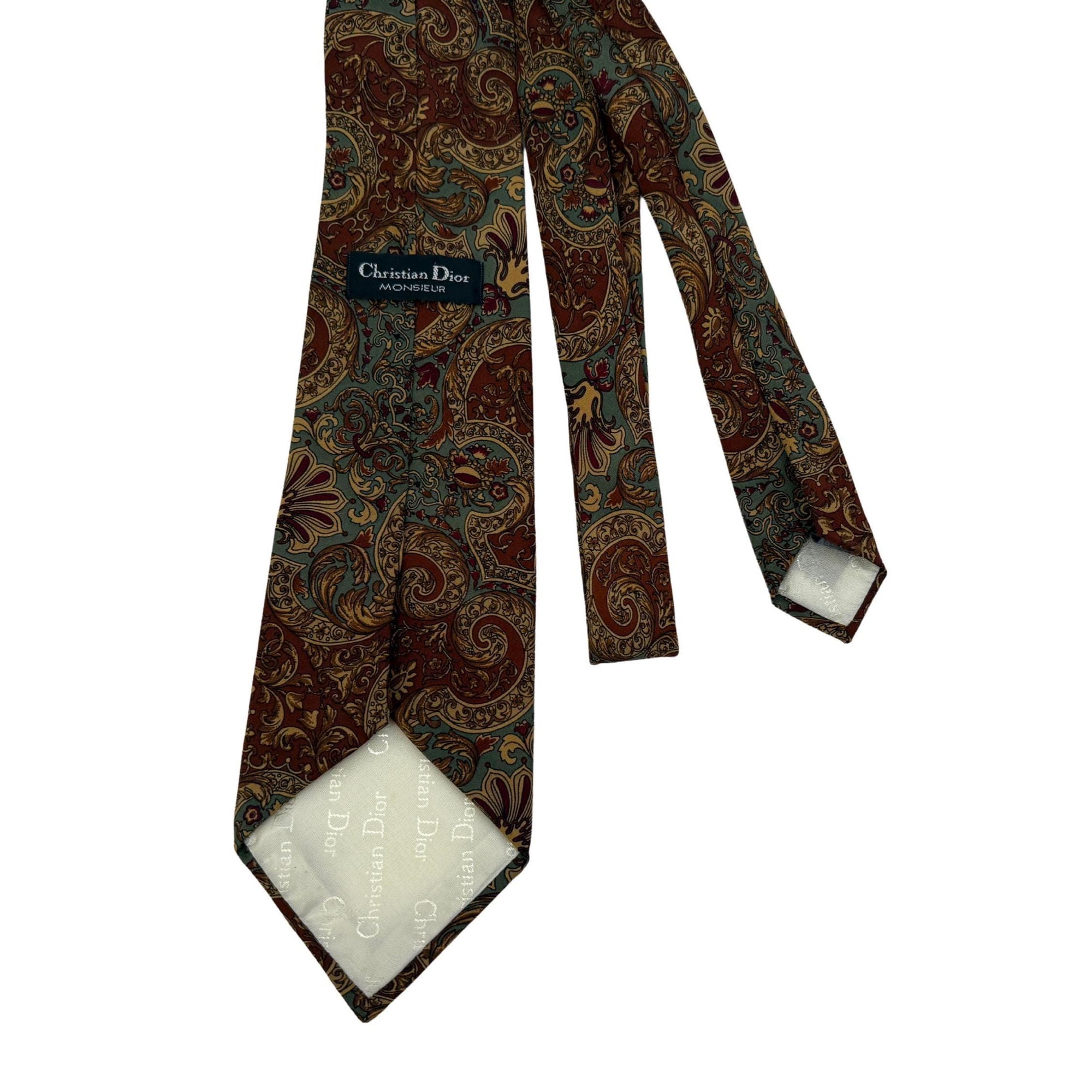 Vintage Christian Dior Silk Tie - Sage & Rust Baroque Scroll
Detailed view of a Christian Dior vintage silk tie with sage green and copper ornate scroll pattern on a neutral background.