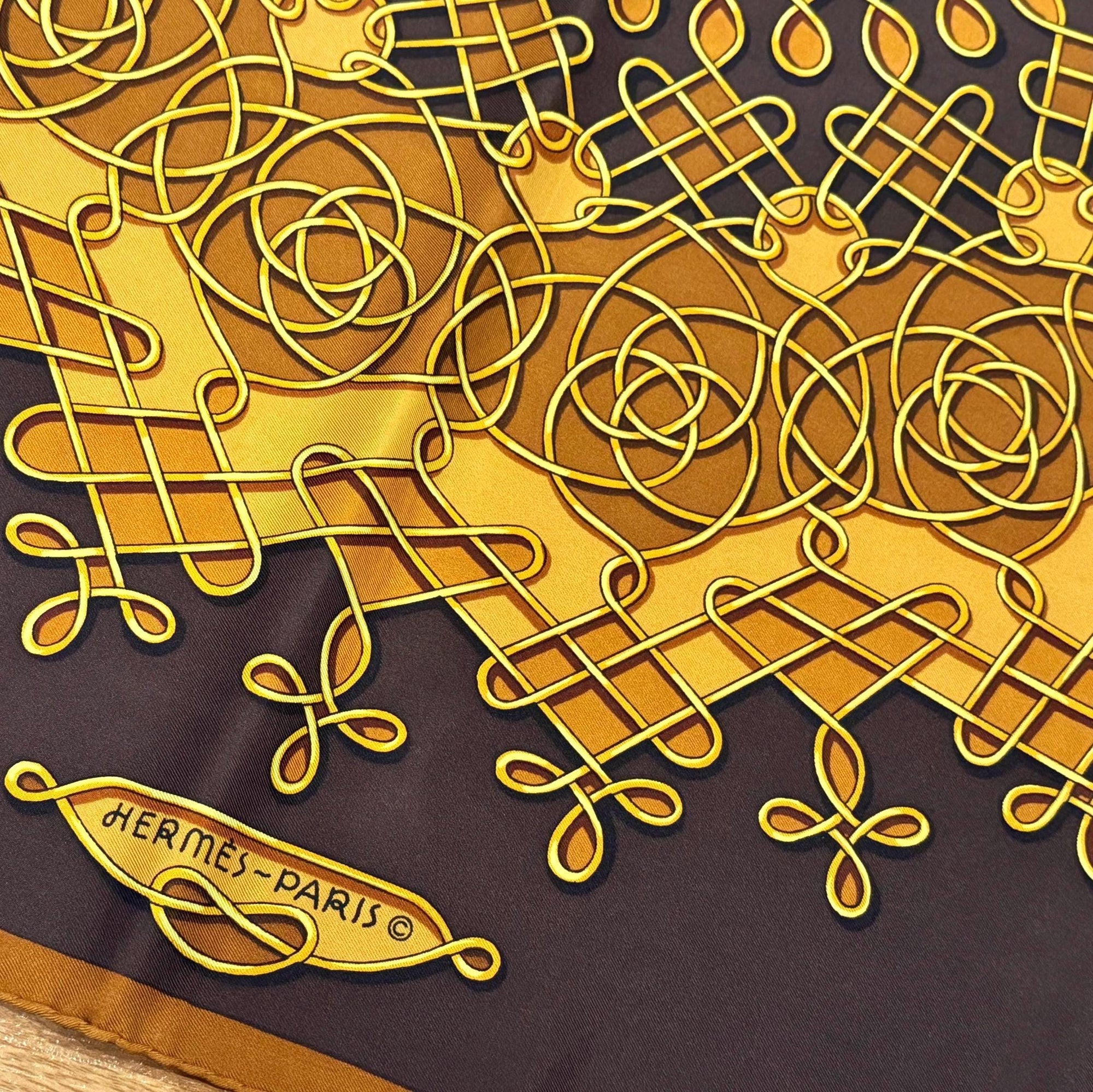 Authentic Hermès "Vinci" 90cm Silk Scarf - Vintage Chocolate & Gold by Françoise Héron