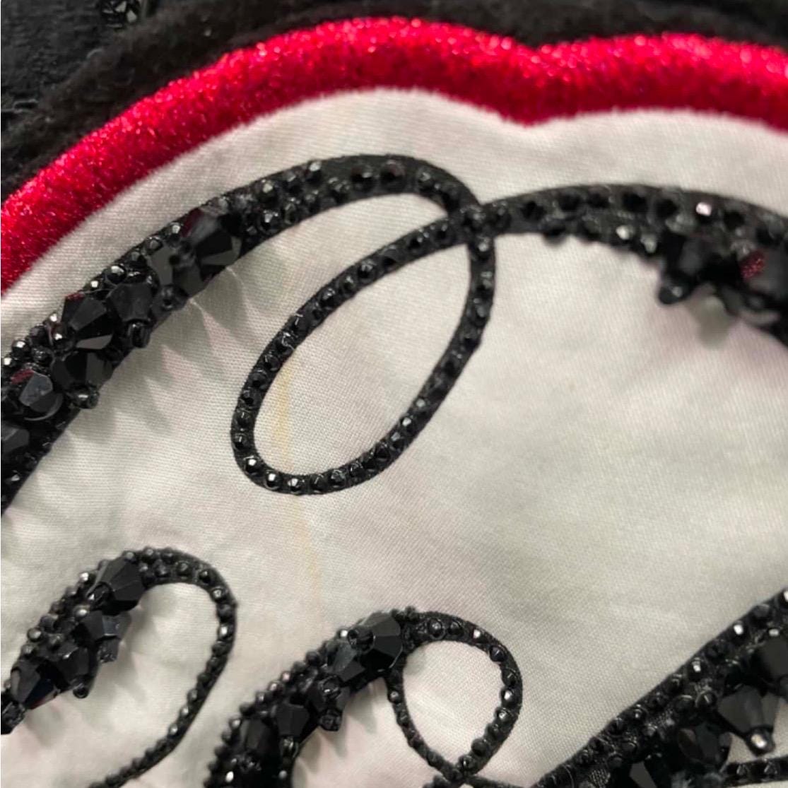 This PINKO x Coca-Cola collab is the perfect amount of "too much." It’s delicate, it’s sporty, and it’s Italian-made. I love layering this over a simple black bralette to let the lace do the talking.
