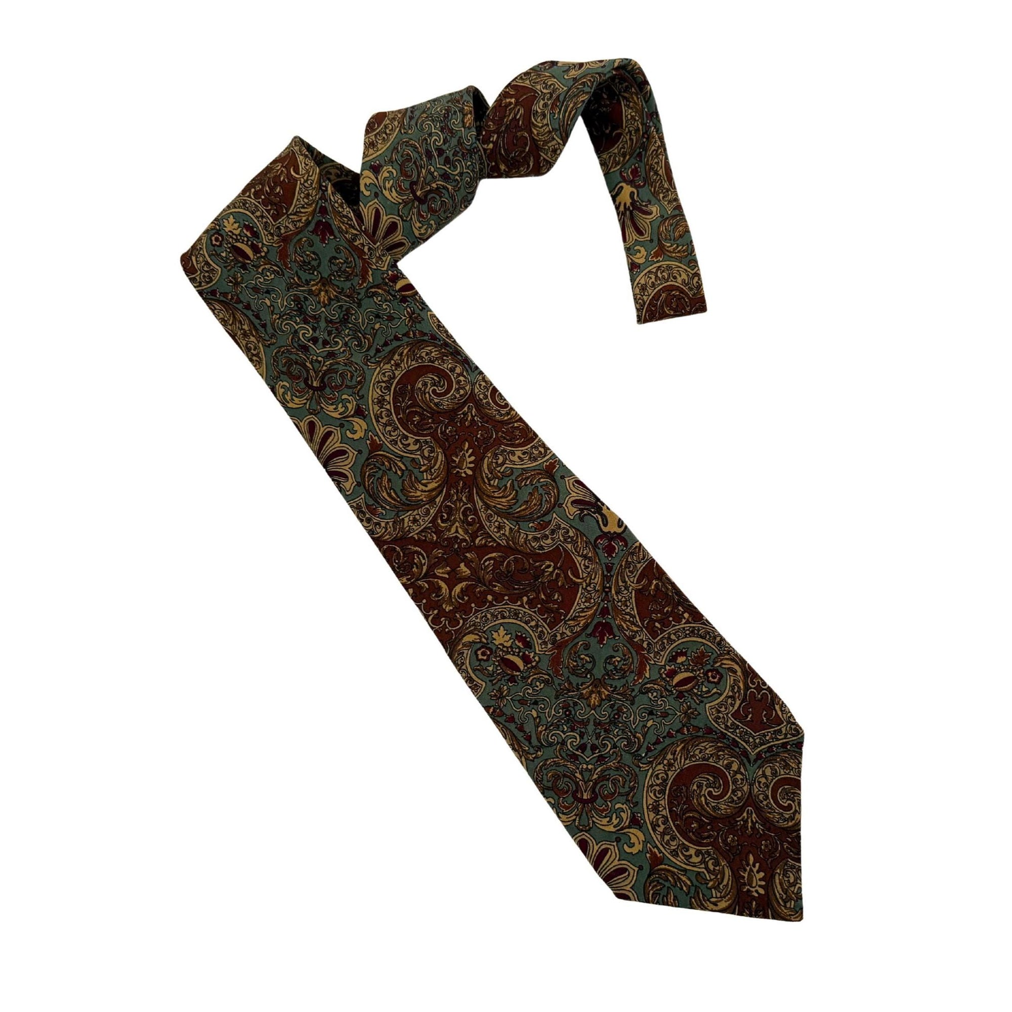 Vintage Dior Tie: Authentic archival Christian Dior silk tie. 10cm blade featuring an intricate sage and rust baroque pattern. A sophisticated statement for the modern, self-made professional. 