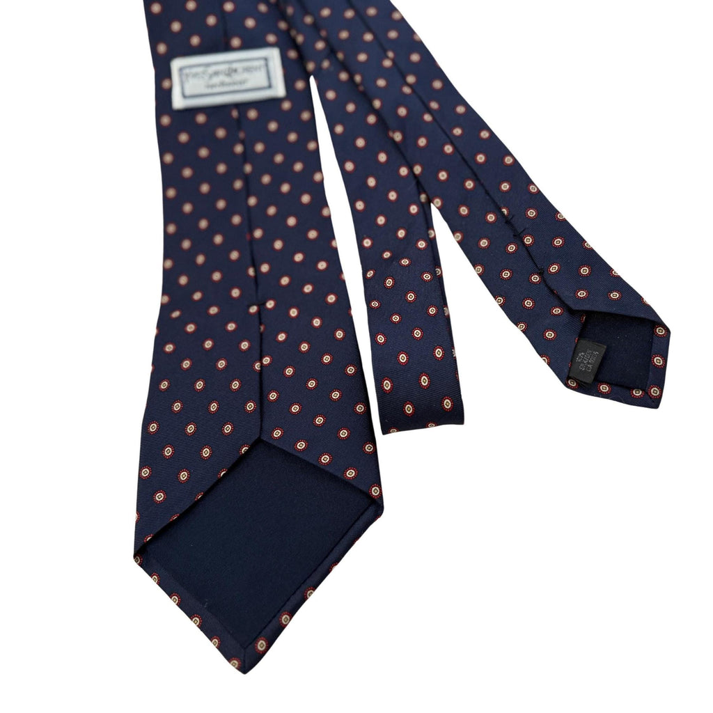 Authentic archival YSL neckwear. Features an 8cm blade and an intricate navy and crimson micro-medallion print. A disciplined choice for the design-led professional.