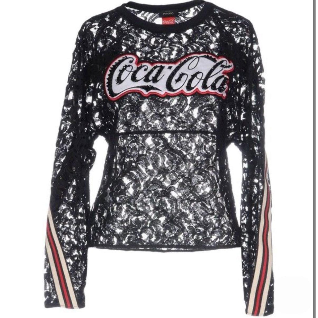 This top is a result of the exciting collaboration between Coca Cola and Pinko, showcasing the perfect synergy of fashion and pop culture. Authentic Coca-Cola for Pinko collaboration top. Featuring Italian black lace, sequined logo, and athletic striped cuffs. Very good condition. Made in Italy.