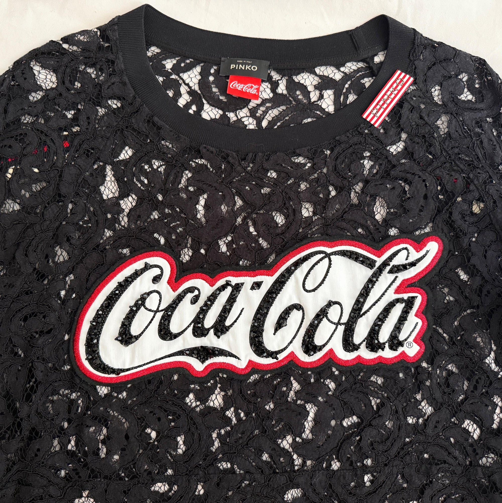1. **Casual Chic:** Pair this black lace top with high-waisted jeans and sneakers for a casual yet chic look, ideal for a day out with friends.  2. **Evening Glamour:** Combine the top with a sleek pencil skirt or tailored trousers and heels for an effortlessly glamorous evening ensemble.