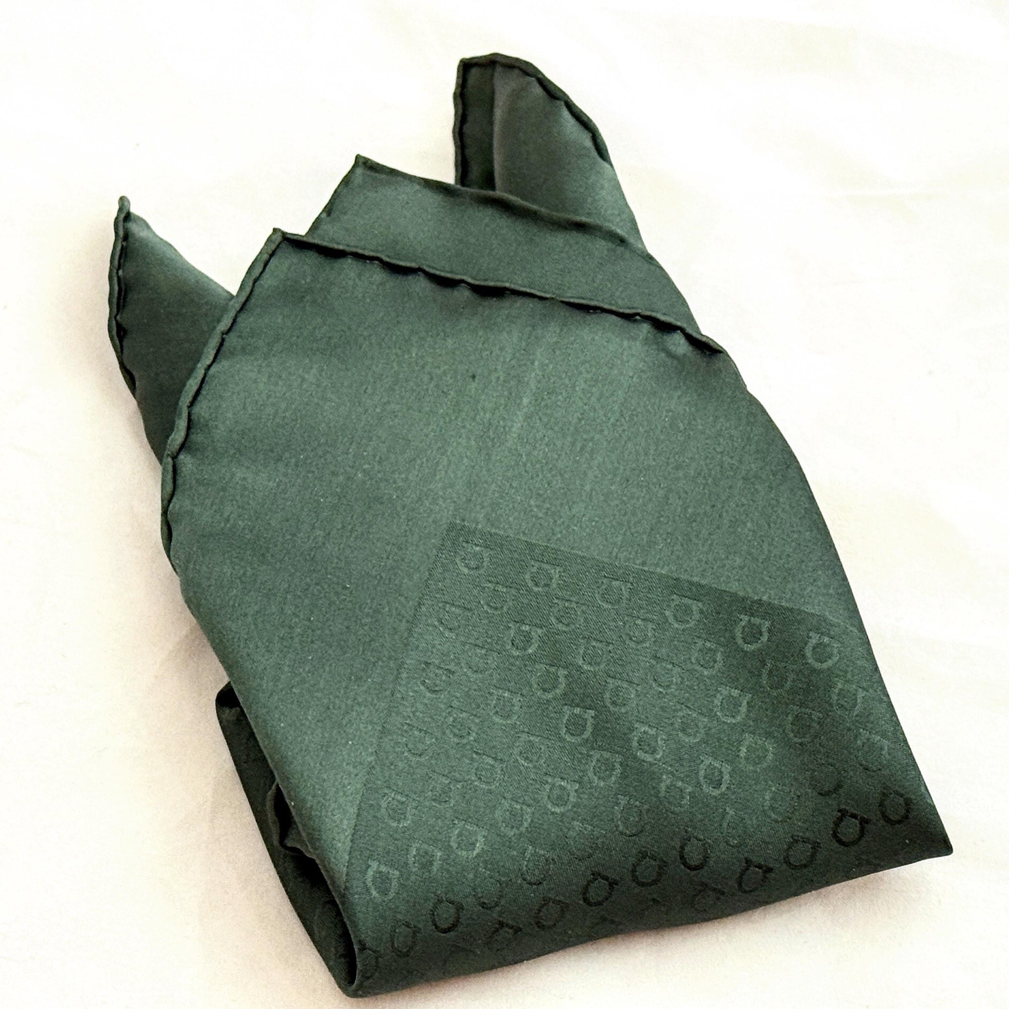 Luxury men’s pocket square in hunter green by Ferragamo